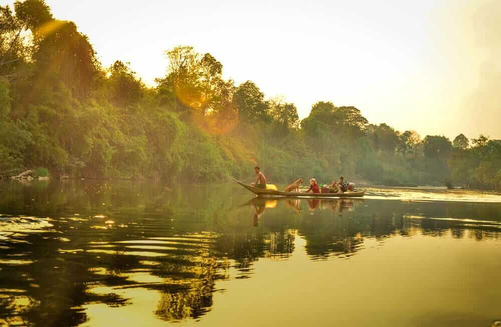 Local residents catch fish in the O’Tabok River in Cambodia.