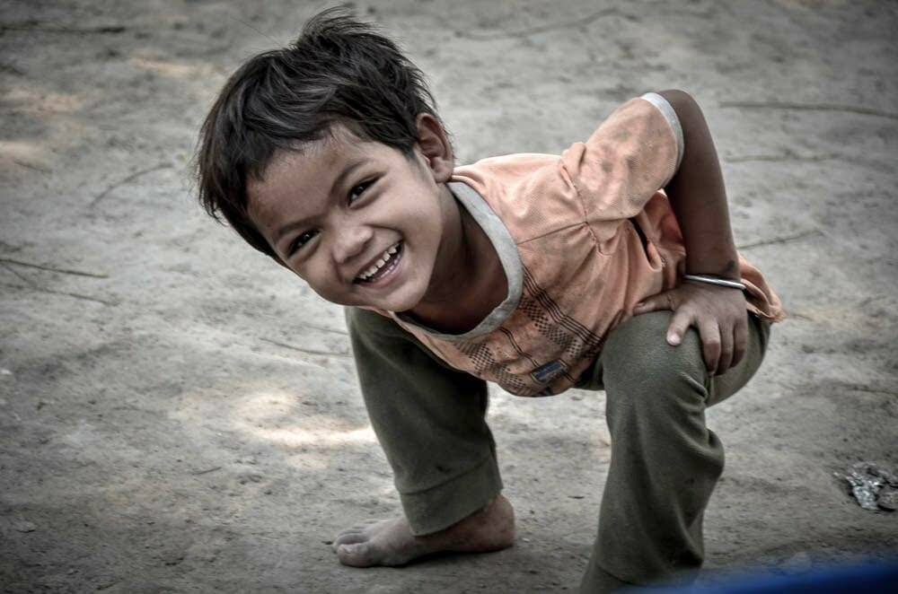 A young member of Mondul Yorn village smiles for the camera.