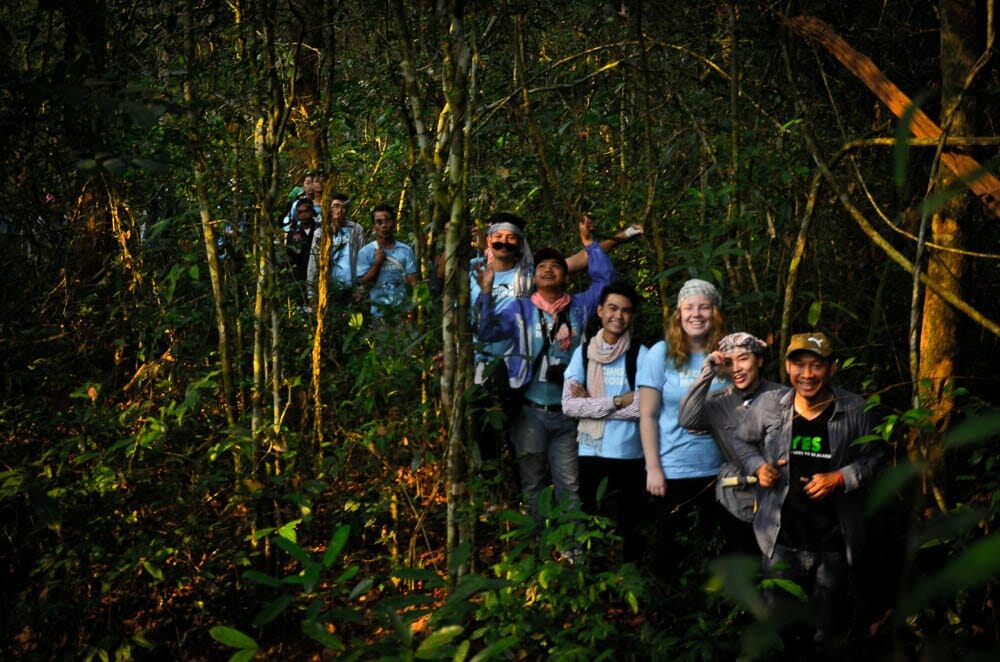 Participants in the youth camp trek in the Virachey National Park together with community members.