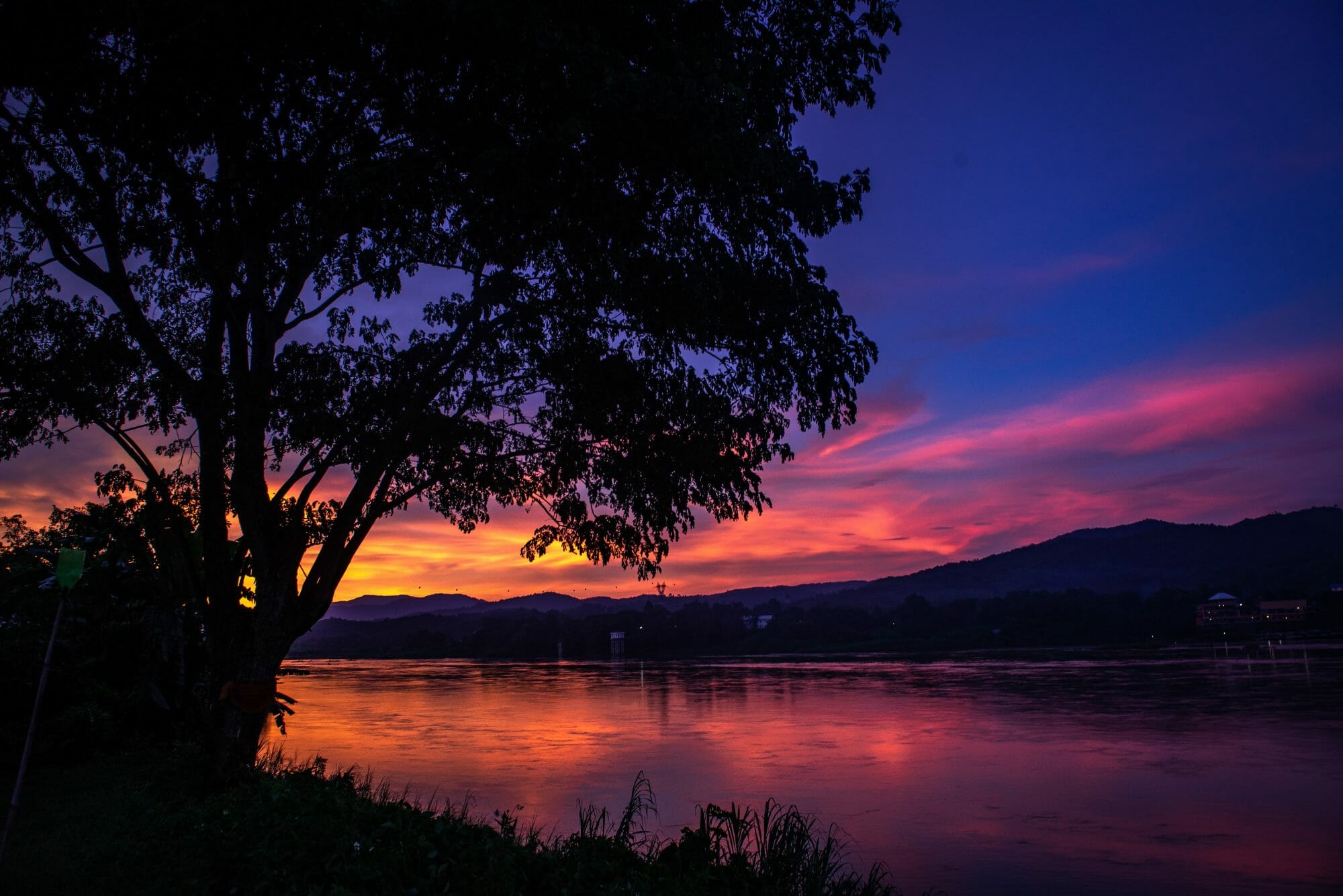 The sun sets on the Mekong River on the Thai-Lao border near Chiang Khong, Thailand.