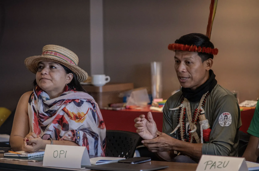 man and woman at a table with name cards infront