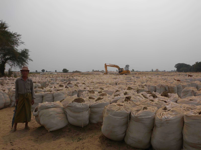 Sandbags completely covering a villager's land beyond the initially agreed to area
