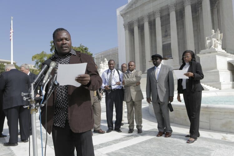 Plaintiff Charles Wiwa speaks with press outside the US Supreme Court